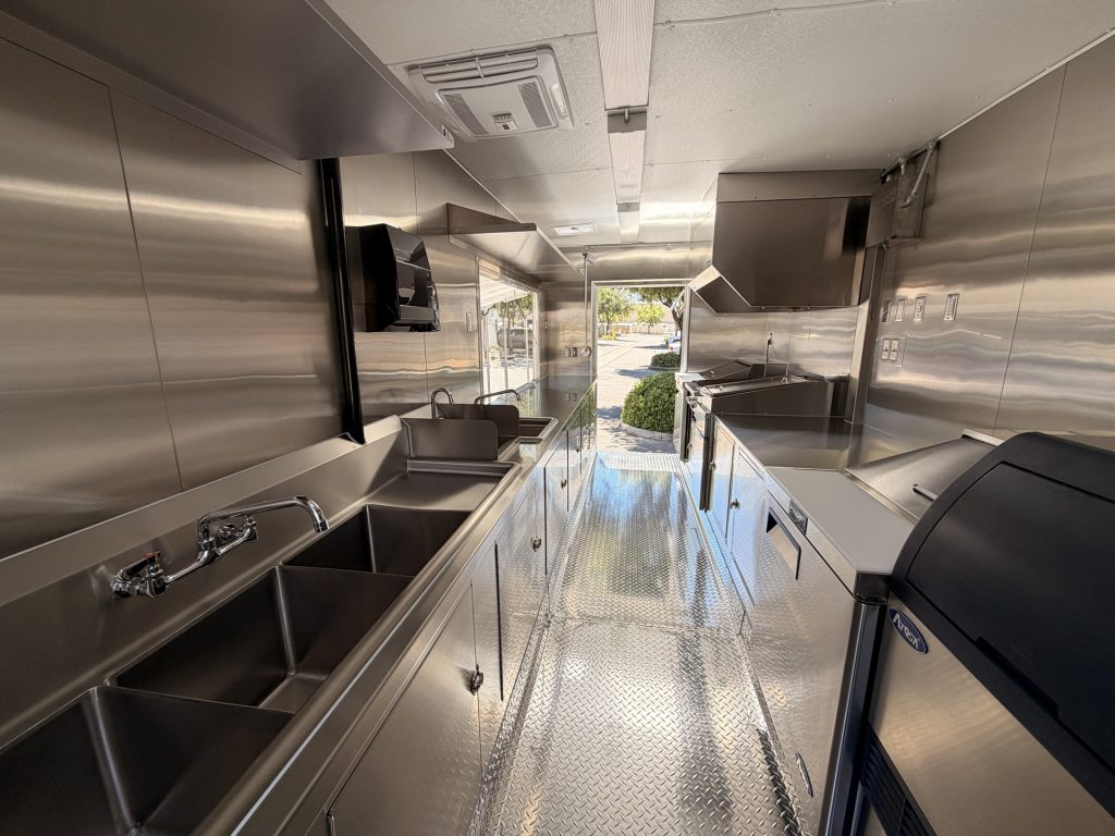 Interior commercial kitchen layout inside Bobo’s Cafe 18-ft custom coffee trailer