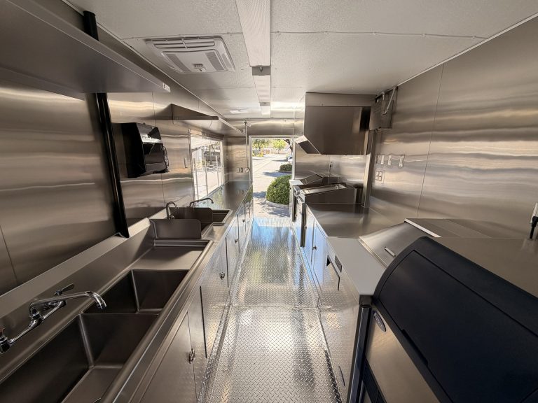 Workstations and aisle inside Bobo’s Cafe coffee trailer