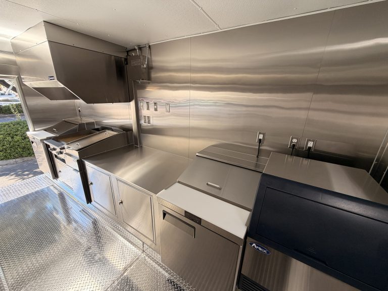 Refrigeration and prep area inside Bobo’s Cafe coffee trailer