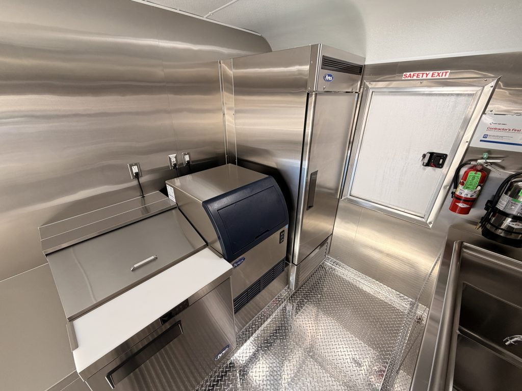Refrigeration and ice production area inside Bobo’s Cafe 18-ft custom coffee trailer