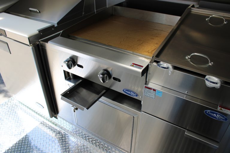Commercial flat-top griddle inside Bobo’s Cafe coffee trailer