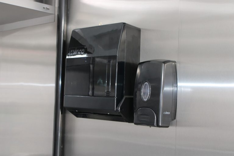 Wall-mounted dispensers inside Bobo’s Cafe coffee trailer