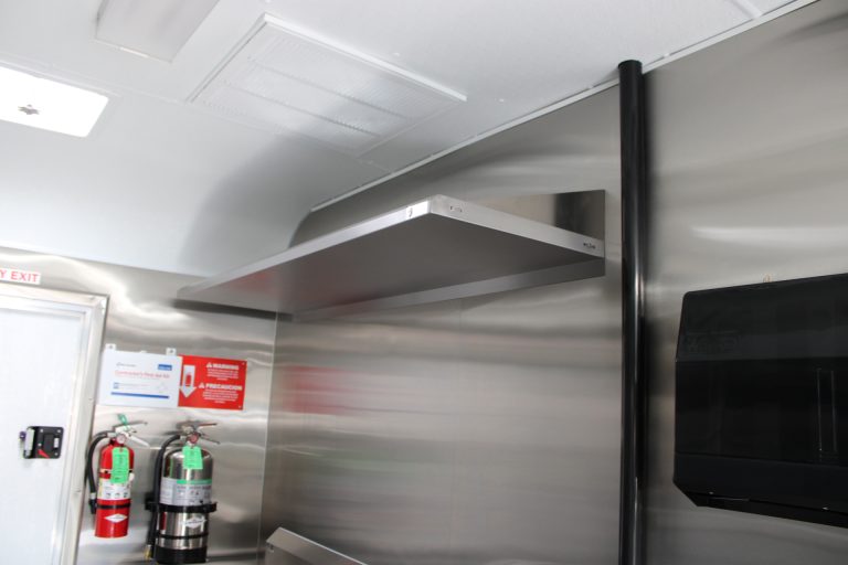 Stainless steel shelving inside Bobo’s Cafe coffee trailer