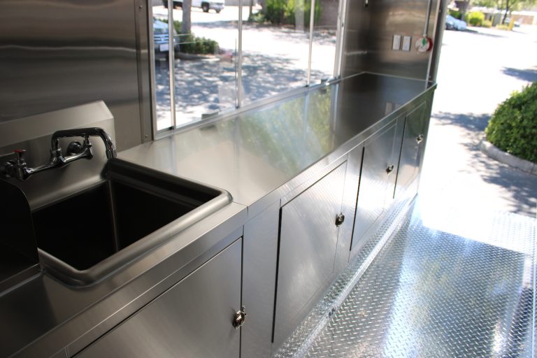 Service counter and concession window inside Bobo’s Cafe coffee trailer