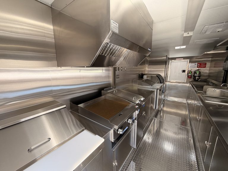 Griddle and fryer inside Bobo’s Cafe custom coffee trailer