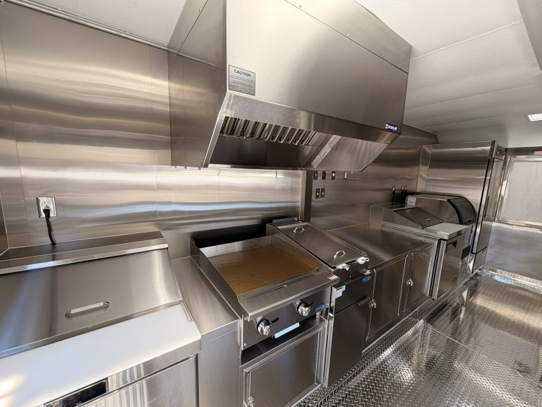 Cooking equipment beneath hood in Bobo’s Cafe coffee trailer