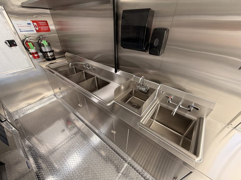Sink and food prep area inside Bobo’s Cafe coffee trailer