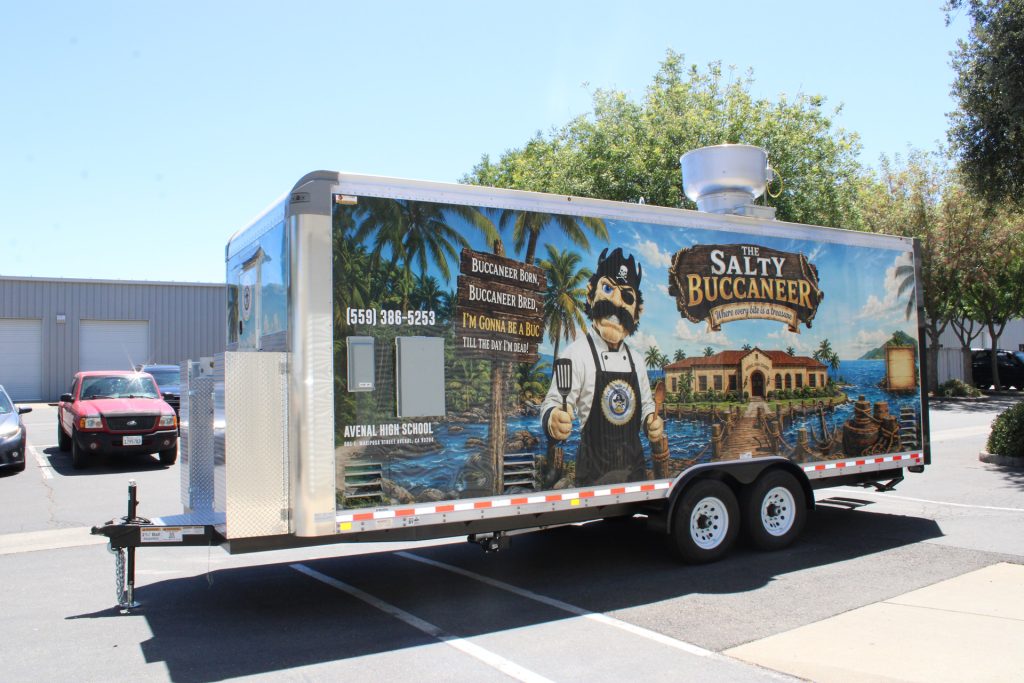 Side exterior view of The Salty Buccaneer 22-ft school food trailer