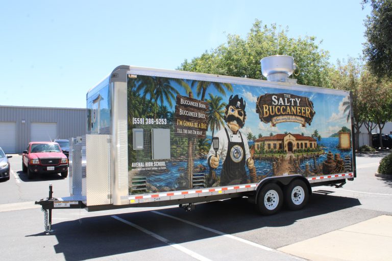 Side exterior view of The Salty Buccaneer 22-ft school food trailer
