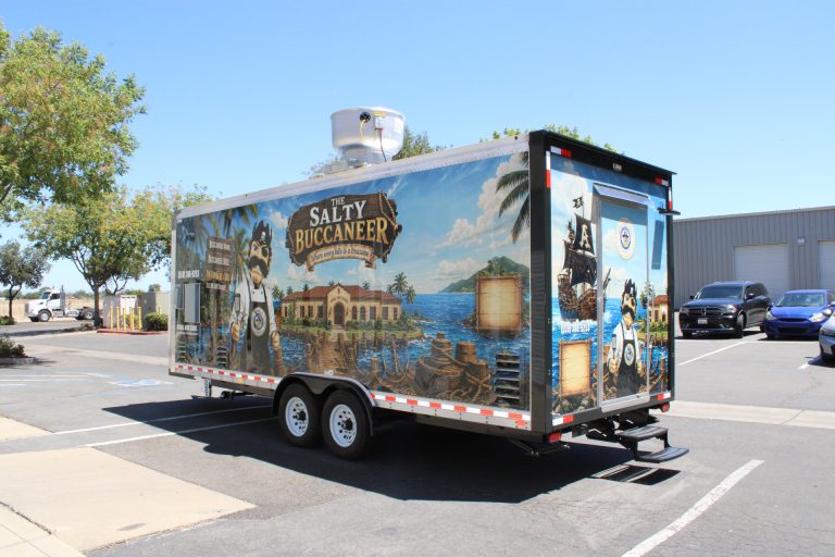 Rear three-quarter view of The Salty Buccaneer school food trailer with nautical wrap