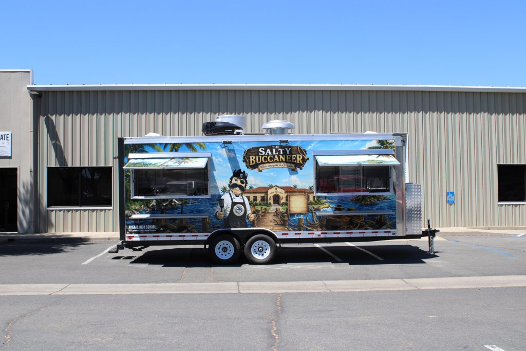Full side view of The Salty Buccaneer custom school food trailer
