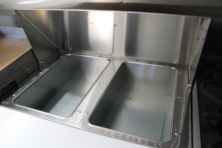 Commercial sink basins inside The Salty Buccaneer 22-ft school food trailer