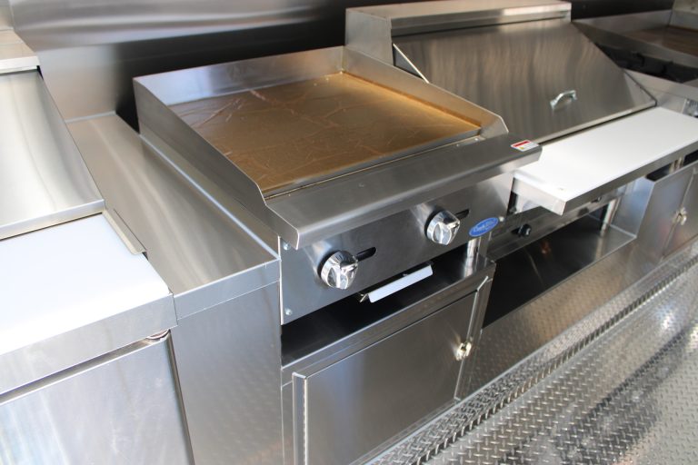 Commercial cooking station inside The Salty Buccaneer school food trailer