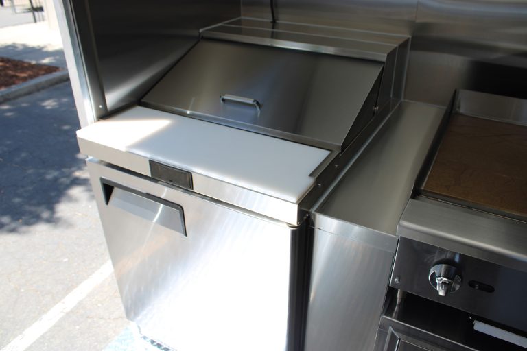 Stainless steel food-service equipment inside 22-ft school food trailer
