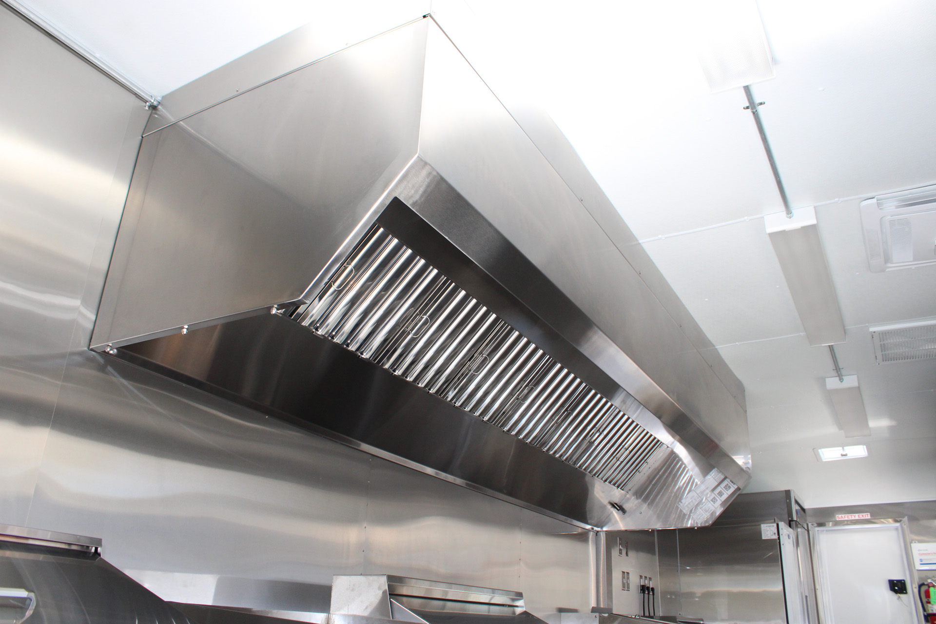 Commercial hood grease filters inside The Salty Buccaneer school food trailer