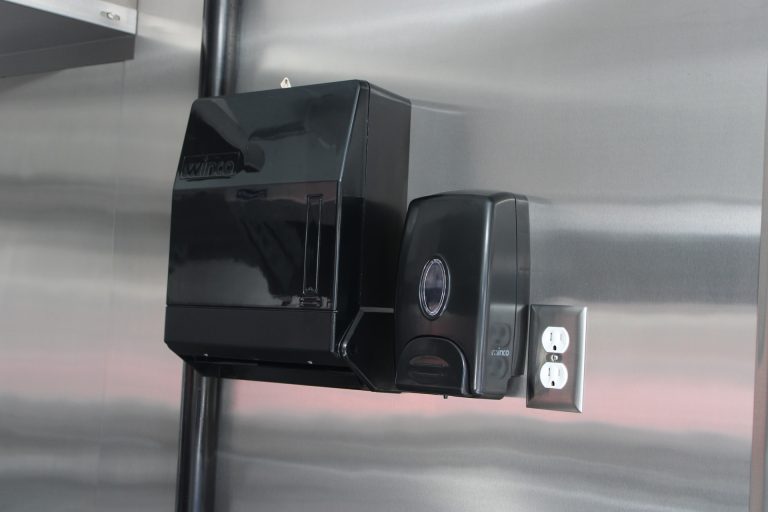 Wall-mounted utility component inside The Salty Buccaneer food trailer