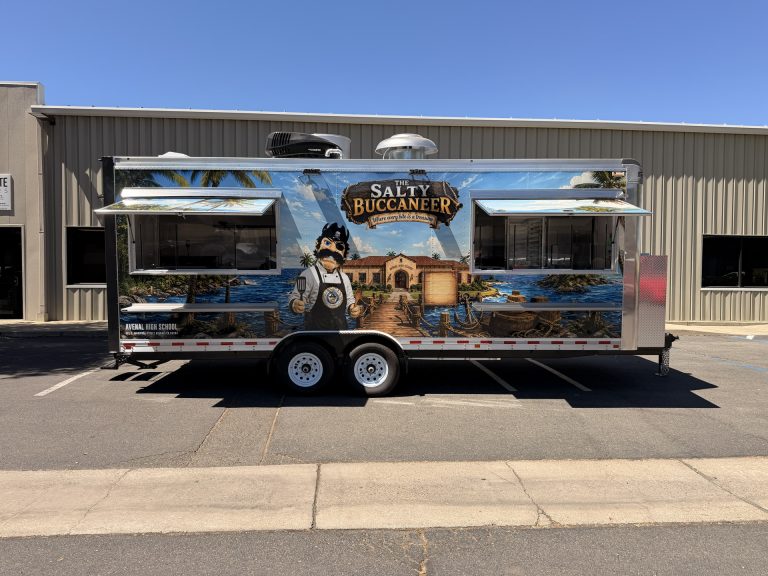 The Salty Buccaneer school food trailer with two concession windows and service shelves