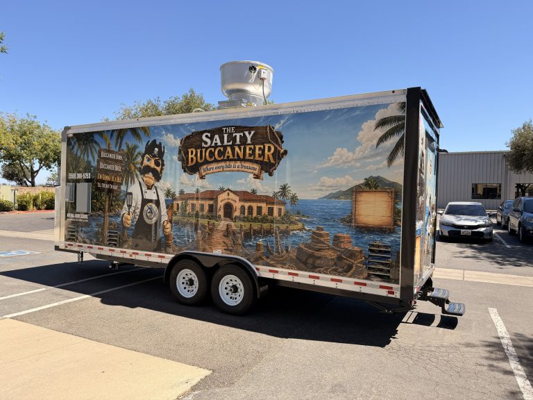 Three-quarter side view of The Salty Buccaneer custom 22-ft school food trailer