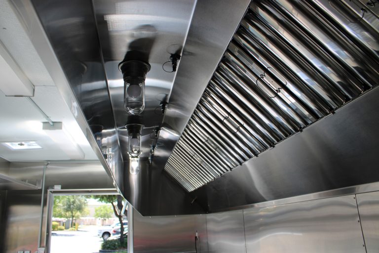 Commercial ventilation hood with grease filters inside 22-ft school food trailer