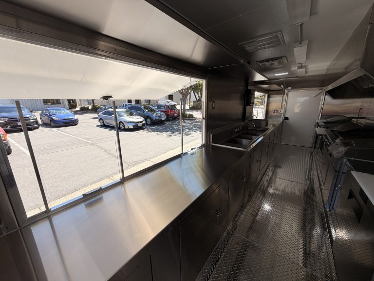 Stainless steel service counter and concession window inside The Salty Buccaneer