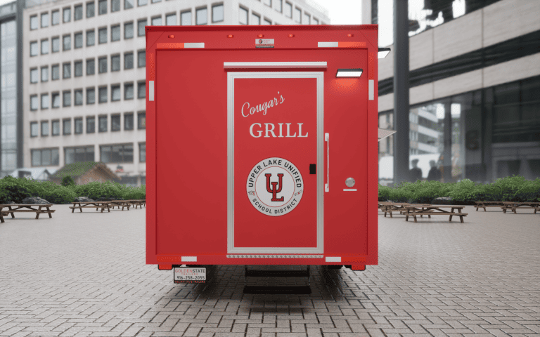 Rear 3D view of Cougar’s Grill school food trailer with Upper Lake Unified School District logo