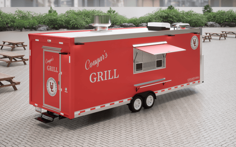 Three-quarter 3D view of Cougar’s Grill school food trailer with concession service side