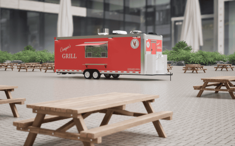 Wide 3D view of Cougar’s Grill 24-ft school food trailer with red exterior wrap