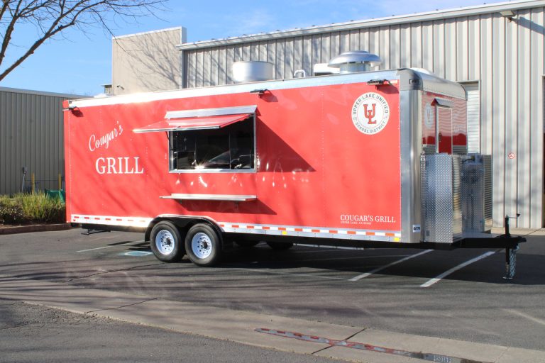 Full side view of the completed Cougar’s Grill school food trailer.