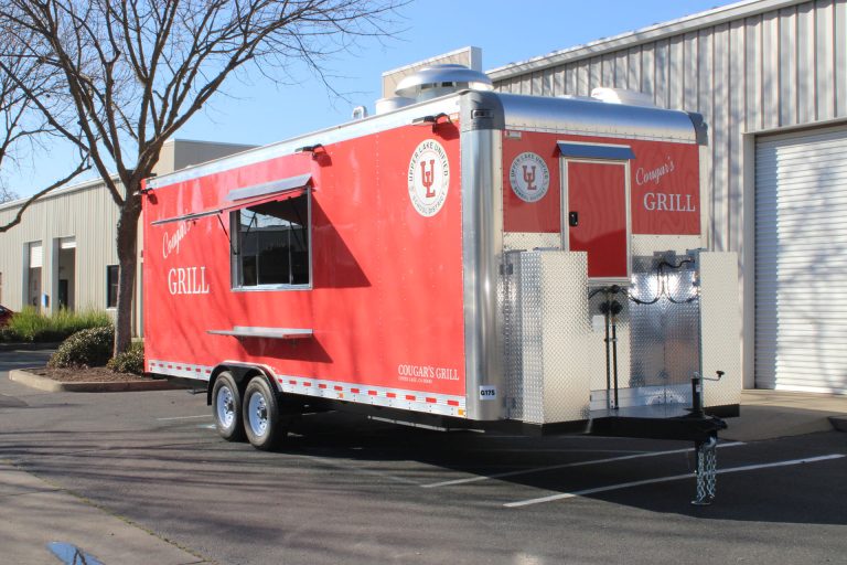 Rear three-quarter view of the completed school food trailer.