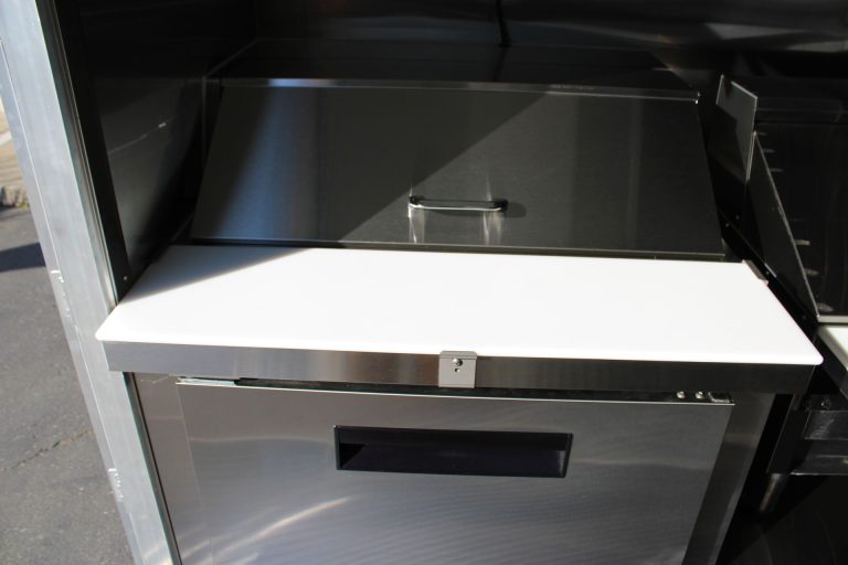 Stainless steel workstation inside Cougar’s Grill school food trailer