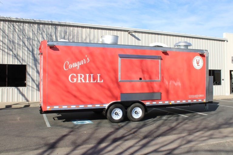 Side view of the Cougar’s Grill school food trailer with custom exterior branding.