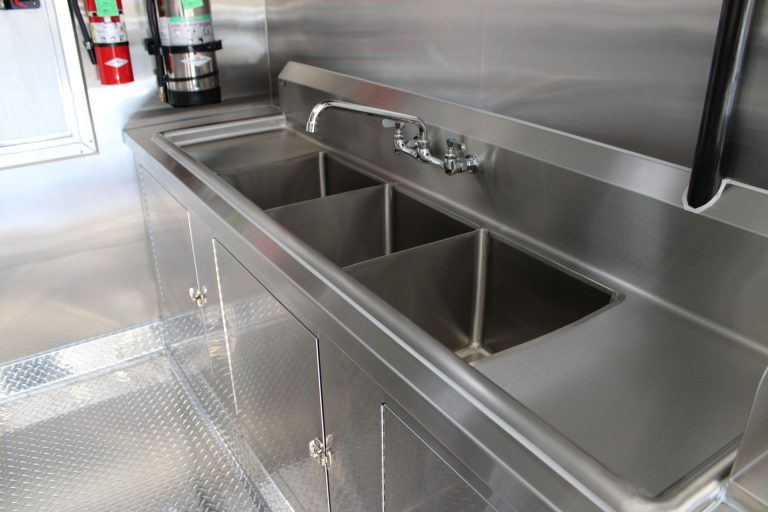 Three-compartment sink inside Cougar’s Grill school food trailer