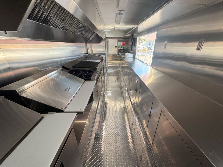 Commercial cooking equipment and ventilation inside Cougar’s Grill school food trailer