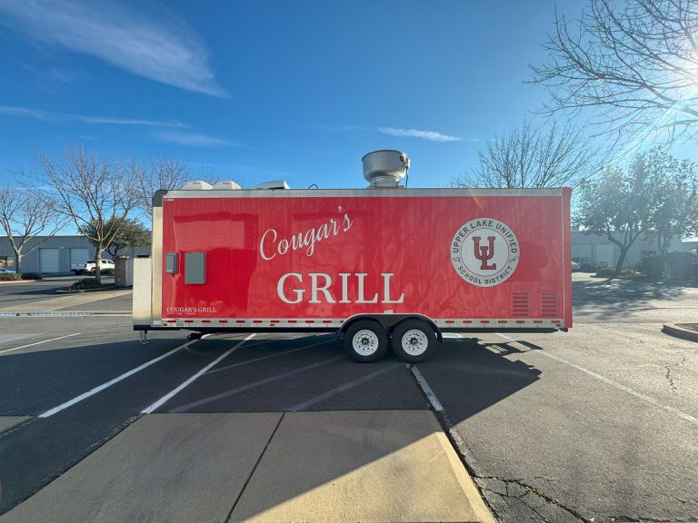 Front exterior view of the delivered Cougar’s Grill school food trailer.