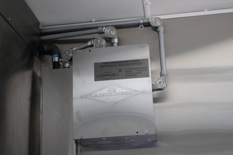 Utility system installation in Cougar’s Grill school food trailer
