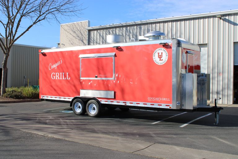 Three-quarter exterior view of the 24-ft Cougar’s Grill food trailer.
