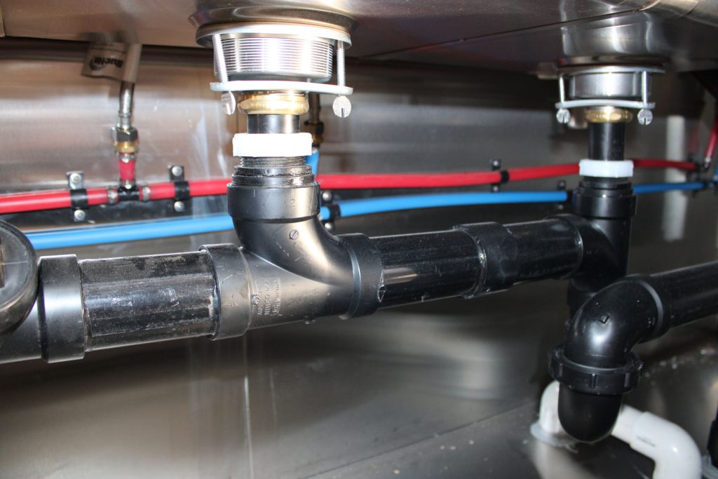 Cougar’s Grill 24-ft school food trailer plumbing system with commercial drain and water connections