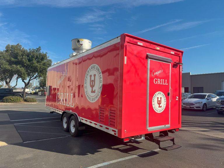 Three-quarter view of the completed Cougar’s Grill school food trailer.
