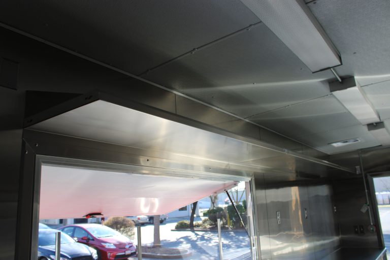 Commercial ventilation hood inside 24-ft school food trailer