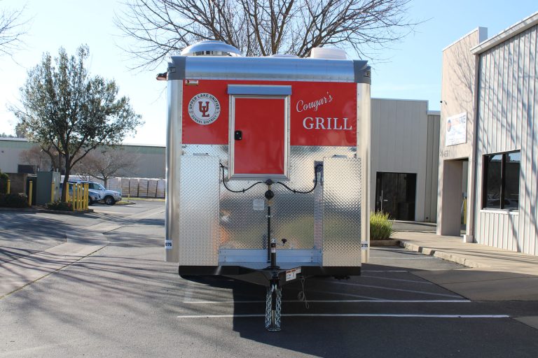 End view of the custom 24-ft Cougar’s Grill school food trailer.