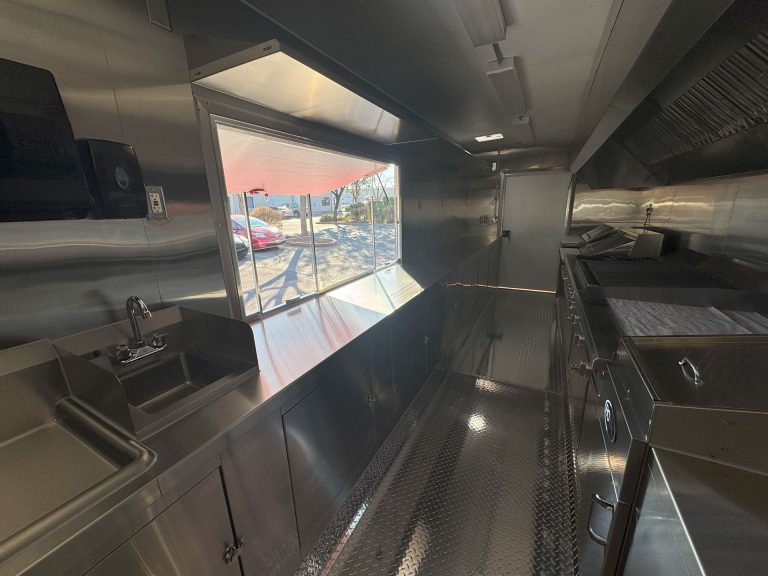 Cougar’s Grill school food trailer interior with service counter and stainless steel workstations