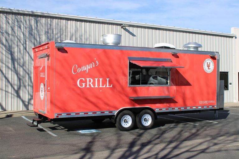 Cougar’s Grill school food trailer with the service window open.