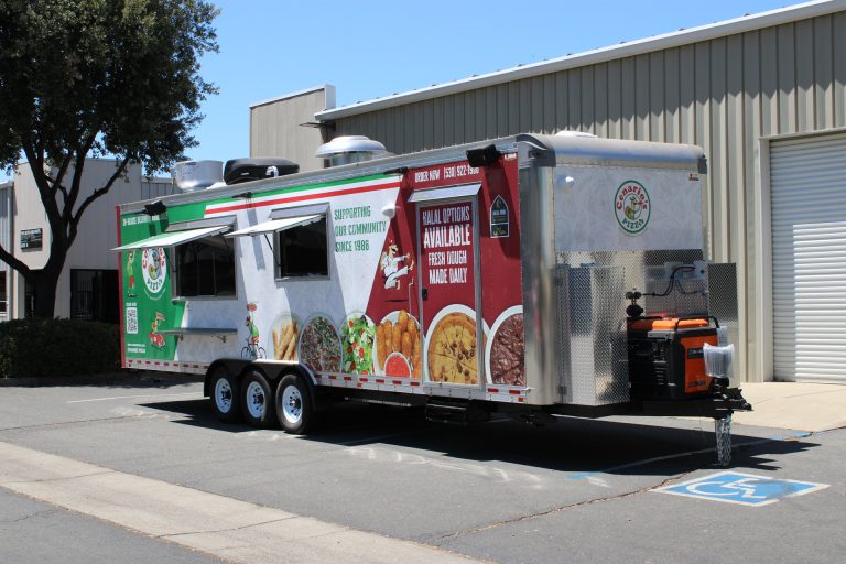 custom pizza trailer service side with concession windows, exterior shelf, wrap graphics, and rooftop ventilation