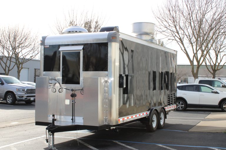 Front-mounted propane tank system on food trailer with dual propane cylinders and automatic changeover regulator for continuous gas supply to kitchen equipment