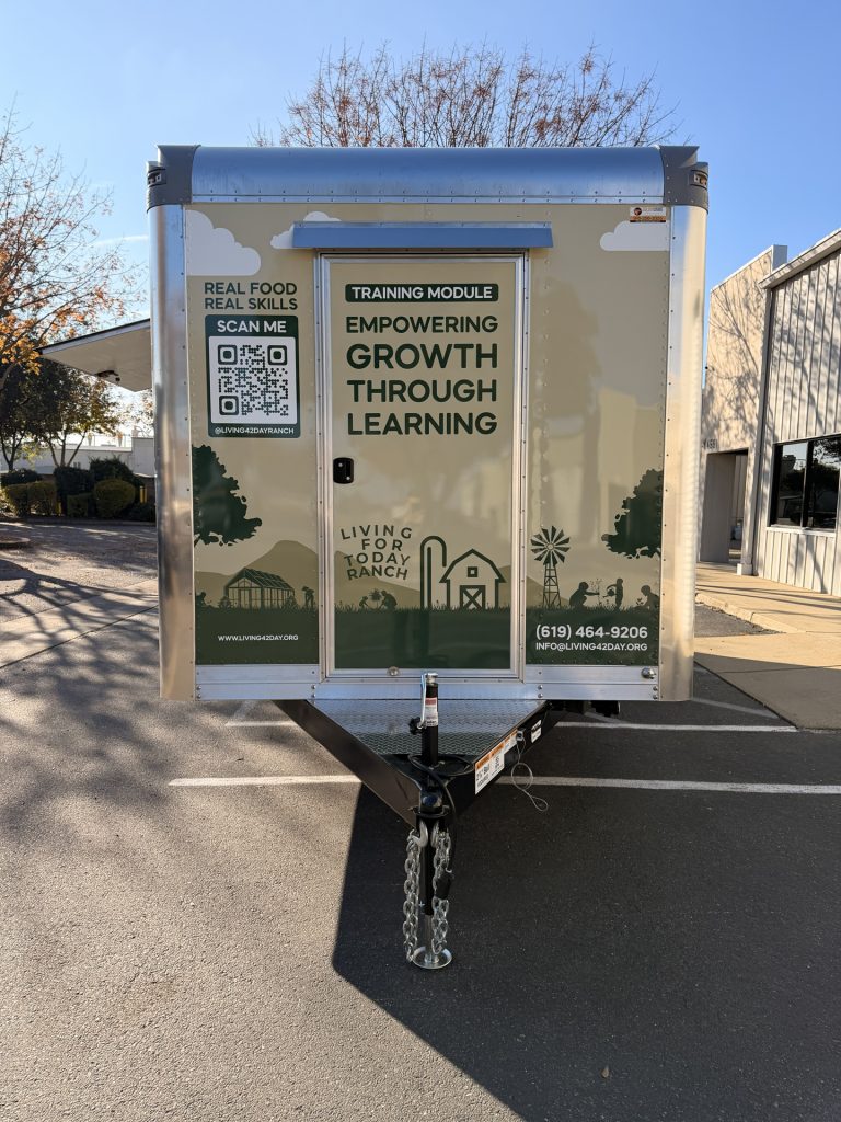 Front view of 20ft training food trailer in Bonita CA with Living for Today graphics