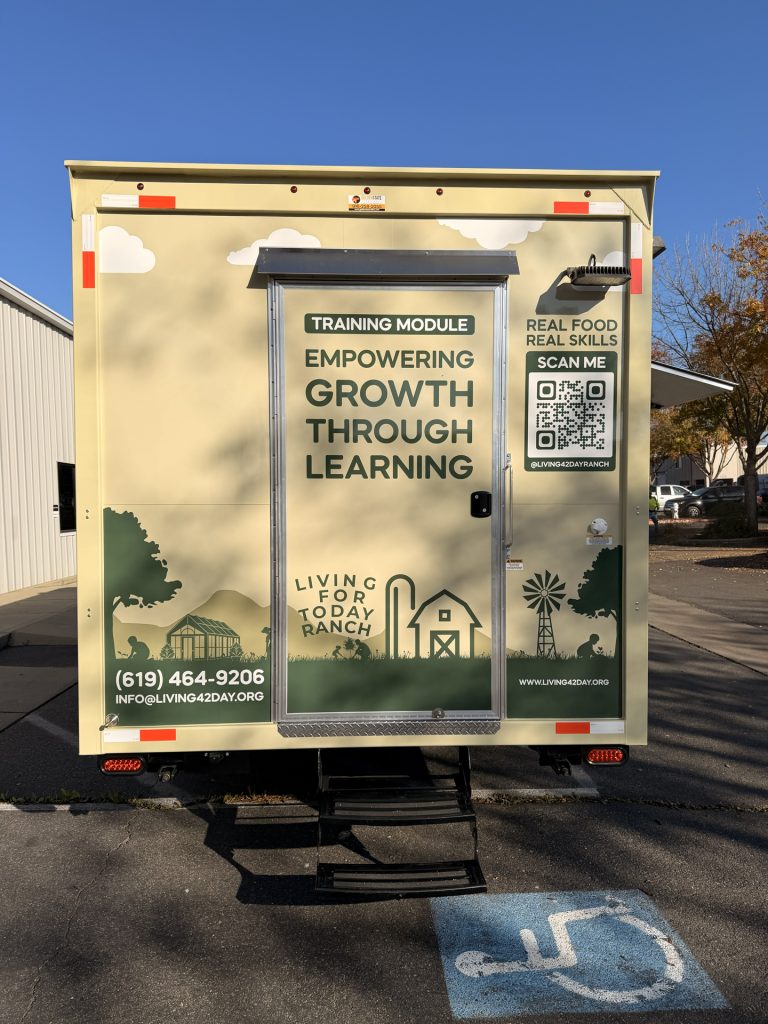 Rear view of 20ft training food trailer in Bonita CA with rear door branding