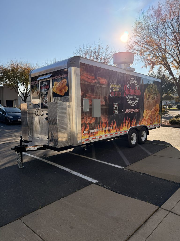 Front angle of BBQ food trailer in Gonzales CA with diamond plate tongue box and dual axles