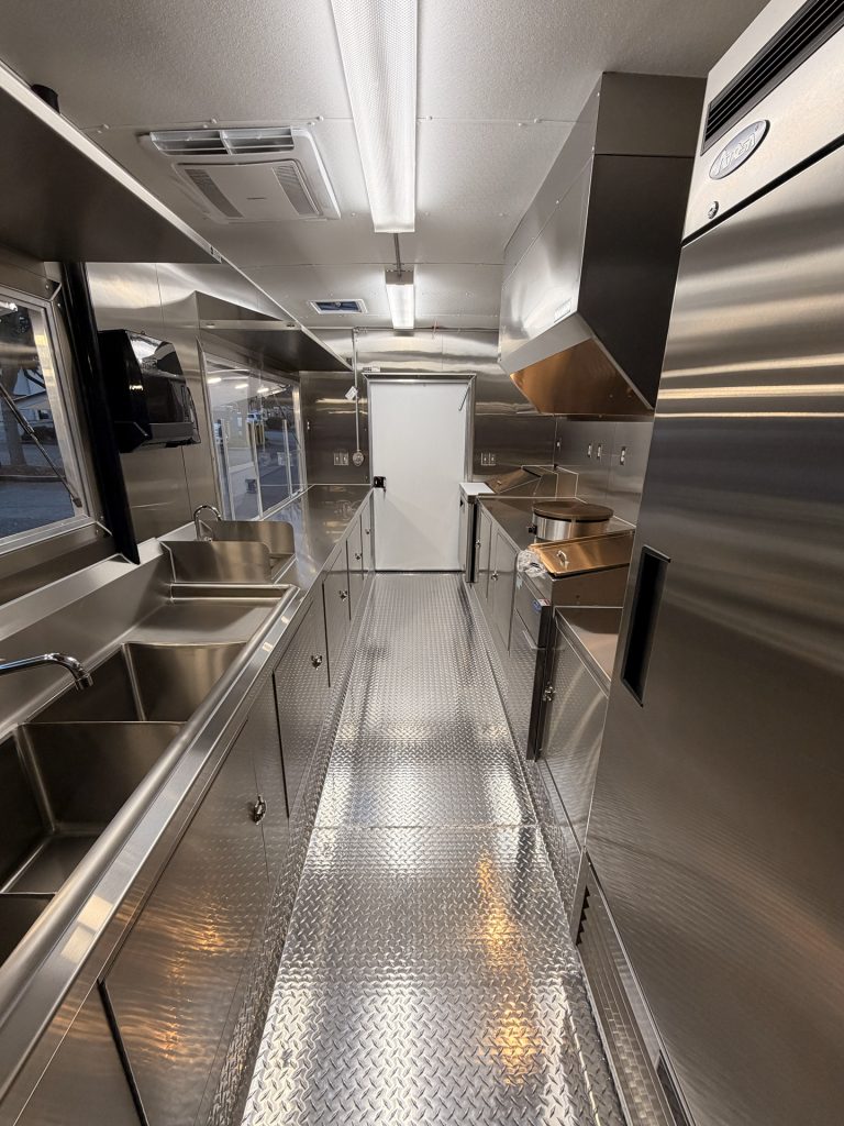 Full kitchen interior of Coffee Trailer for Sale in Fair Oaks CA with refrigeration and sinks