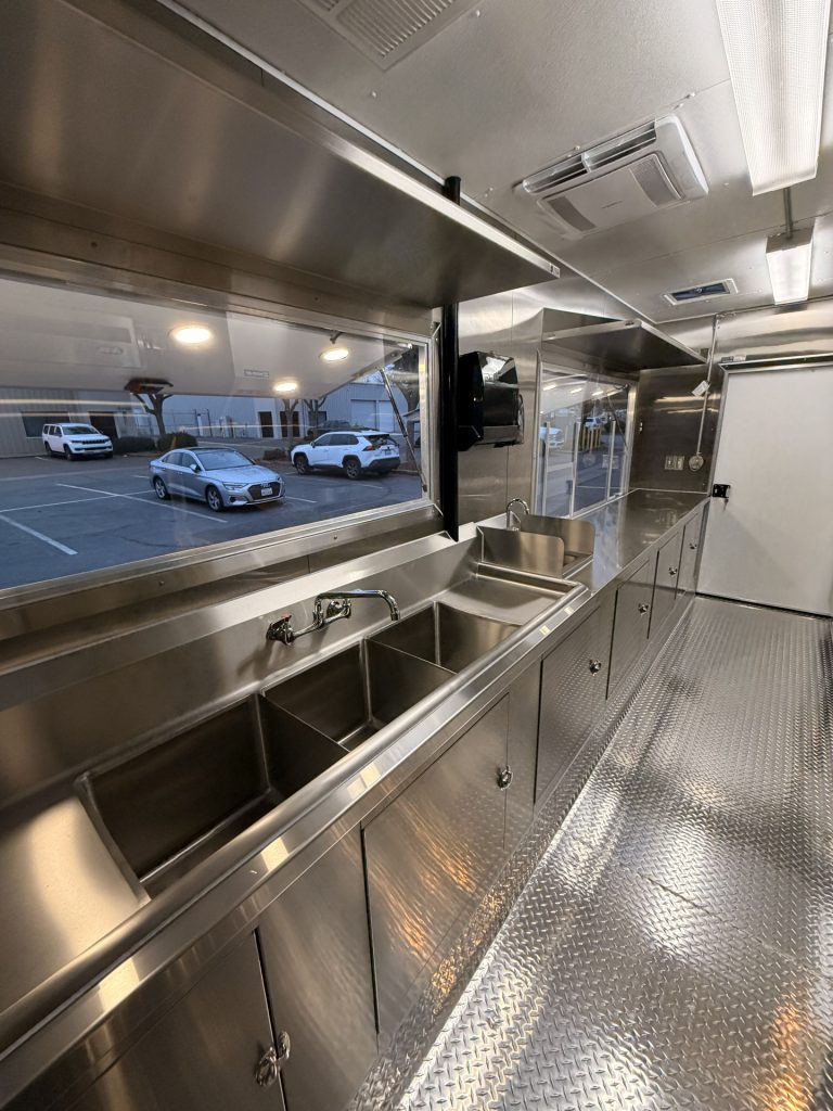 Three compartment sink and service window inside Coffee Trailer for Sale in Fair Oaks CA