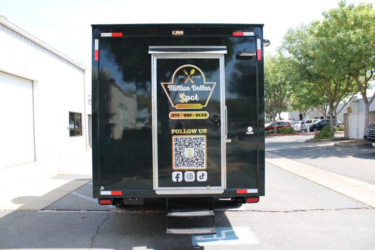 18ft American food trailer black rear door panel Million Dollar Spot logo QR code social media icons dual axle Golden State Trailers Tracy CA